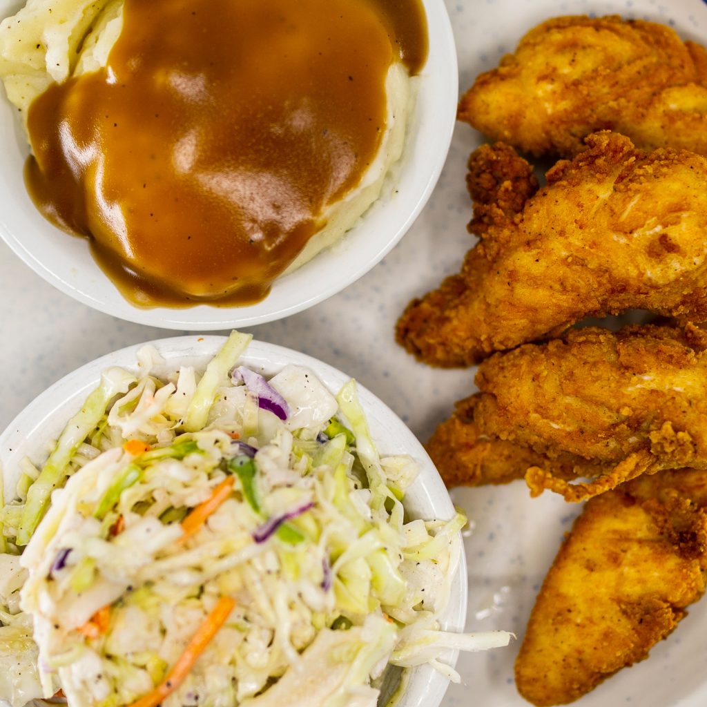 Experience the warmth of tradition with our Southern Fried Chicken Fingers, a taste of home at Blue Plate Cafe.