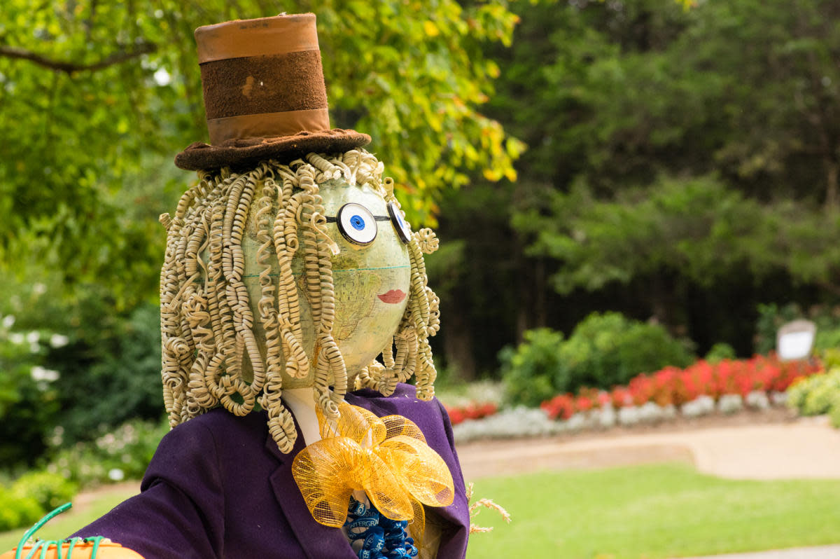 A whimsical journey through the enchanted Scarecrow Trail, illuminating the magic of the Garden's Festifall.